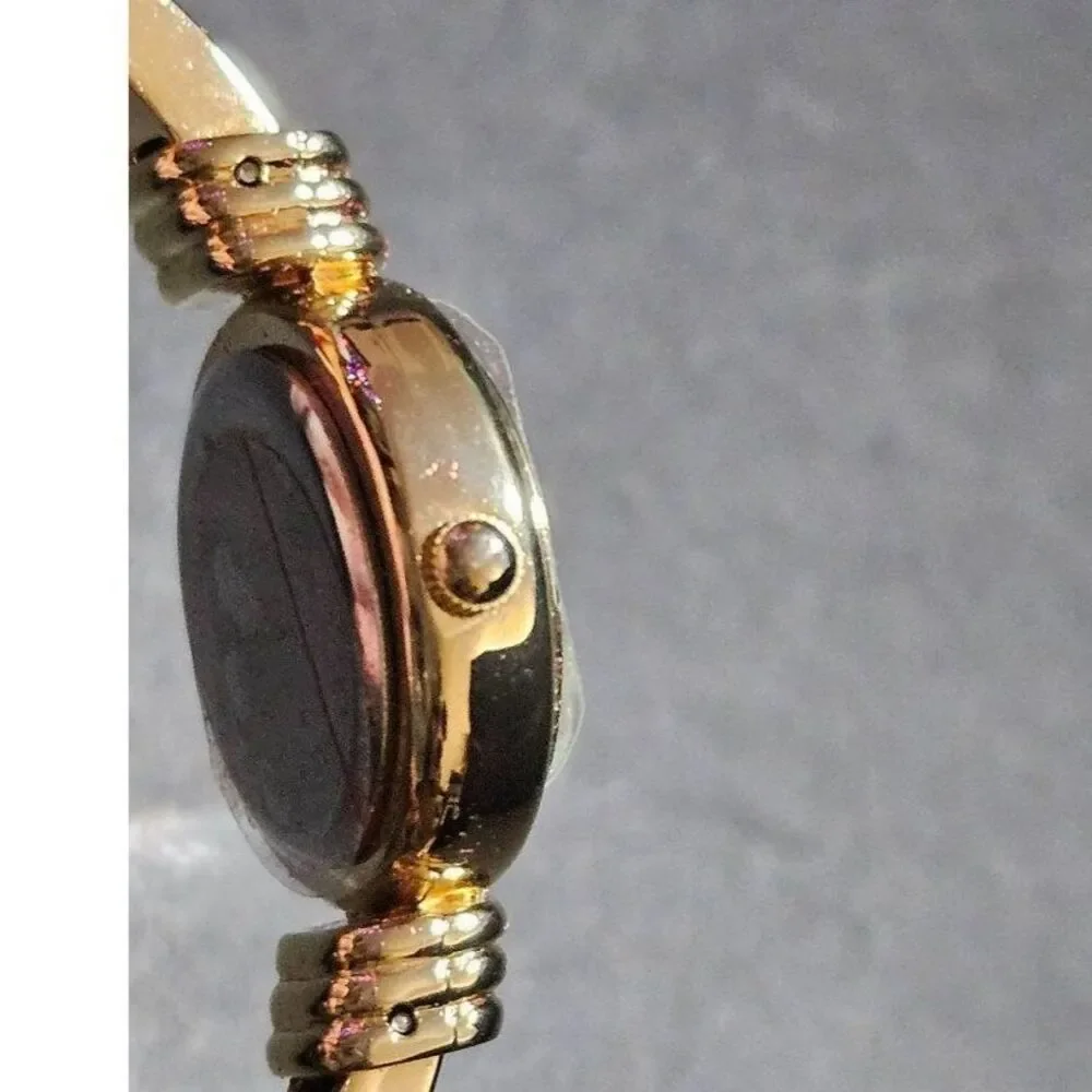 Holiday Lane gold tone snowflake watch